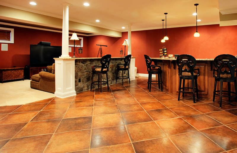 Popular-Choices-for-Designing-Electrical-Service-This-Spring-Finished Basement with Bar Seating featuring Recessed and Pendant lights